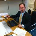 Julian Huppert at desk in Westminster